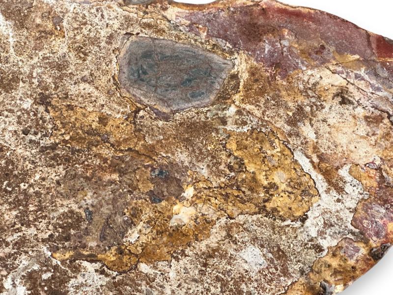 STONE COFFEE TABLE IN REDDISH TONES